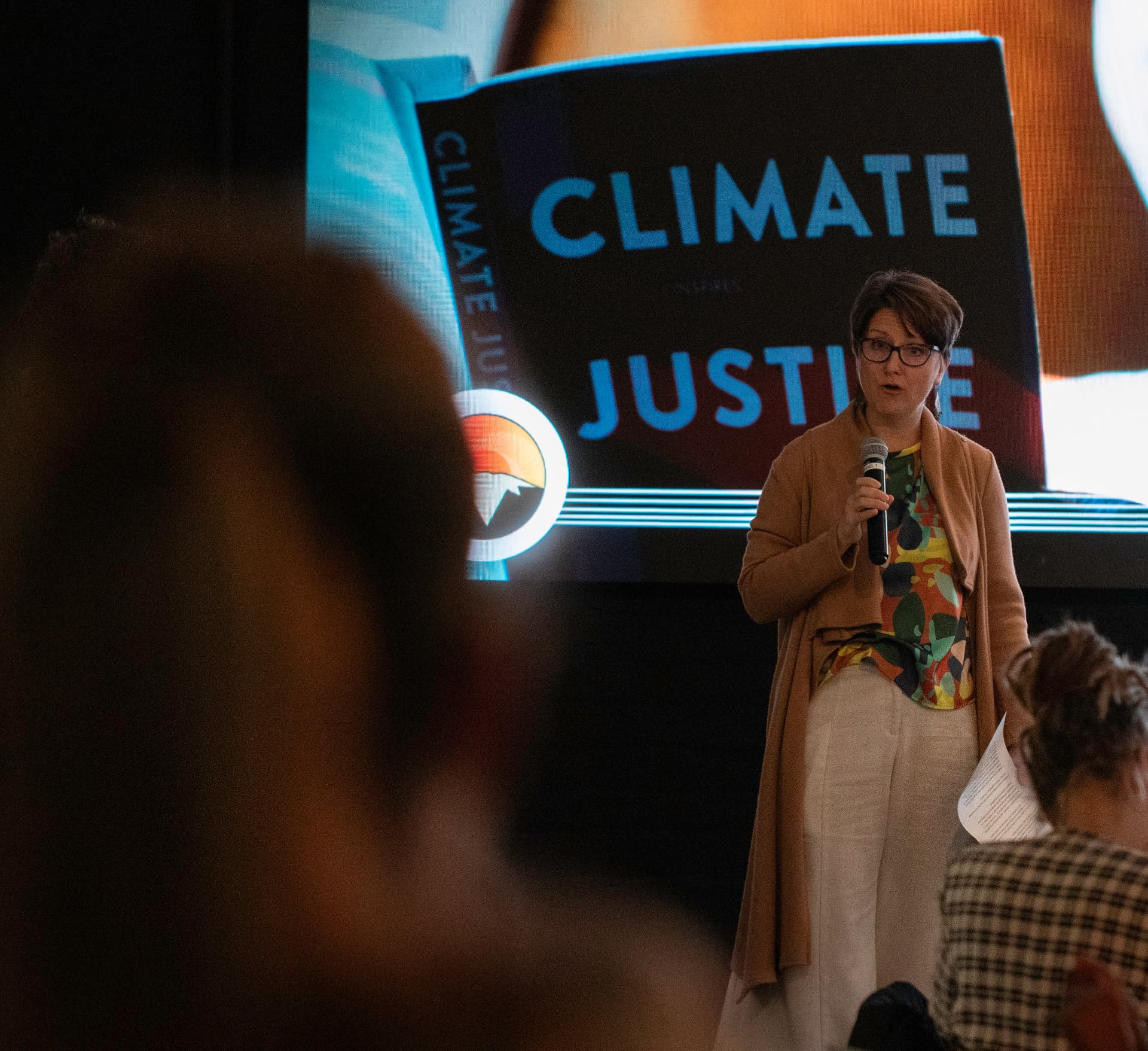 A speaker presenting on climate justice